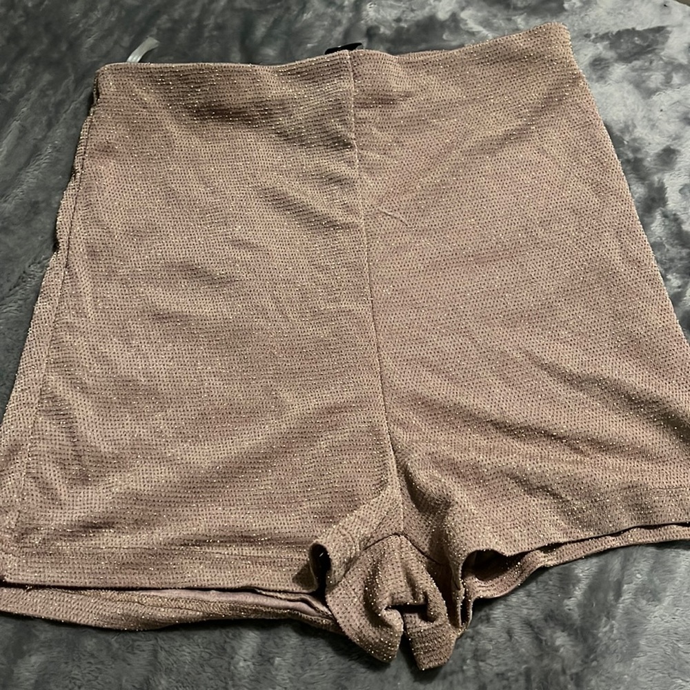 Woman’s glittery high waisted shorts